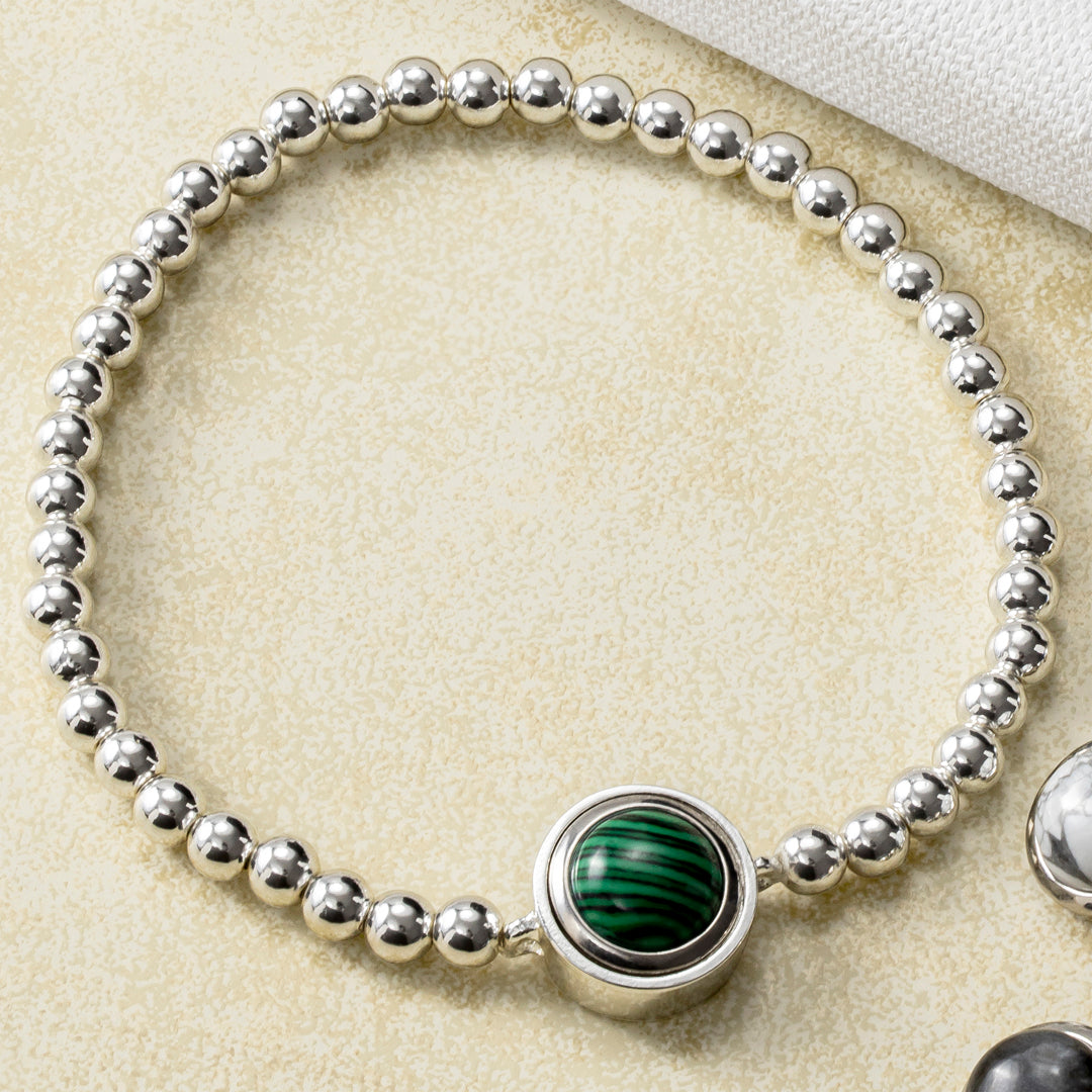 Silver beaded bracelet and interchangeable stone center