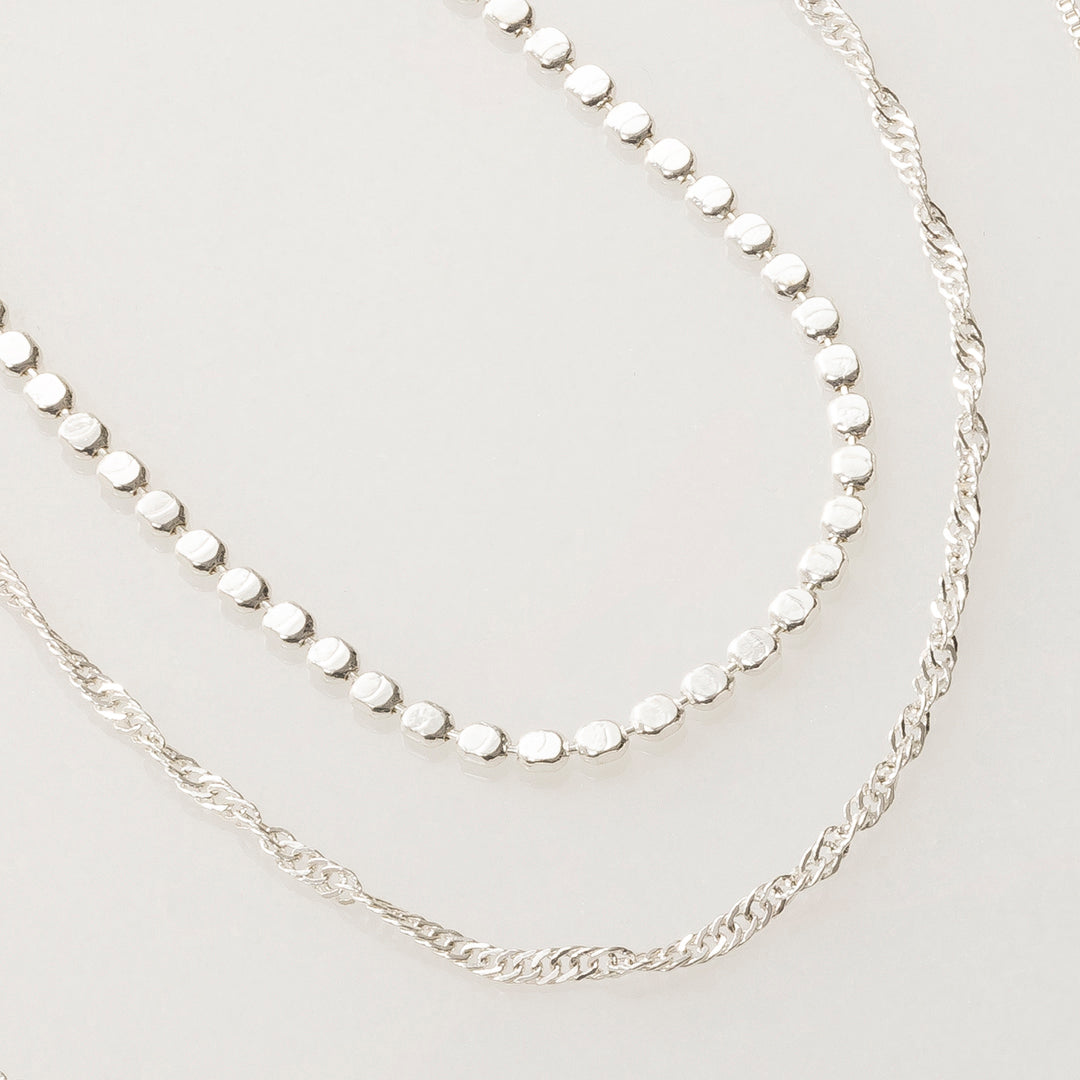 Layering necklaces in silver finish and for dainty jewelry