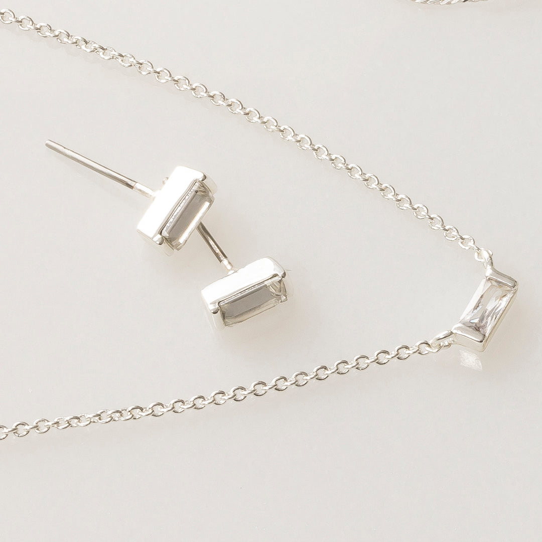 Dainty jewelry in silver baguette earrings and necklace