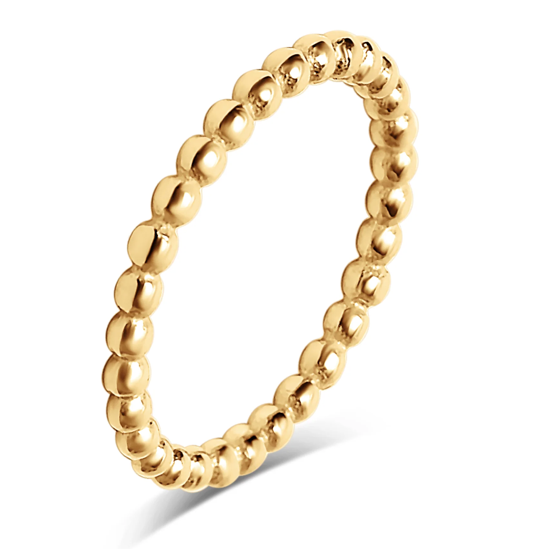 A polished yellow gold beaded ring, shown at an angle on a clean white background with a soft shadow. Launched for Style Dots October 2026 -- style perfect for stacking your rings year round 