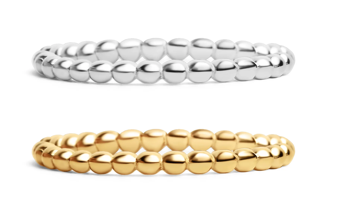 Two beaded rings, one in silver and one in yellow gold, displayed side by side on a clean white background. Perfect for stacking or adding to an existing ring set. 
