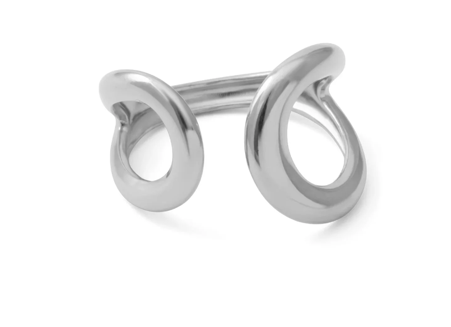 A polished silver-toned metal ring with an abstract, openwork design featuring two curved loop-like elements shown on a clean white background.