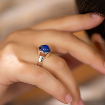 Silver cocktail ring with interchangeable stone in blue
