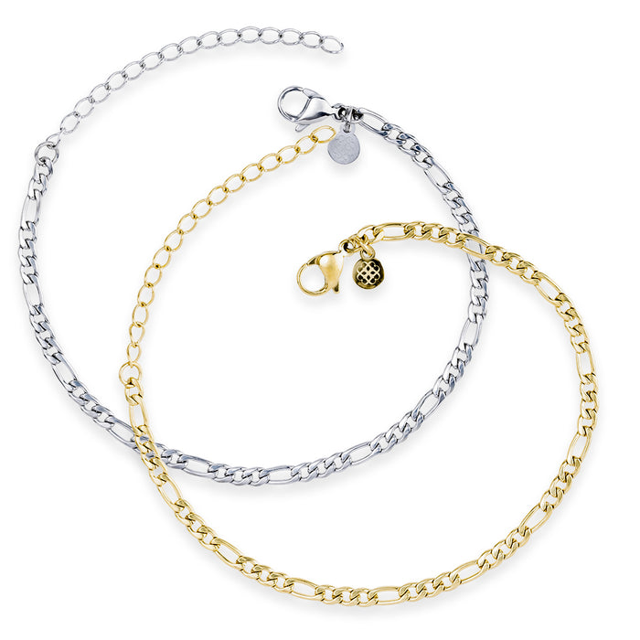 Two delicate chain bracelets in a figaro pattern, one in silver-tone and one in gold-tone, arranged in a circular flat-lay on a white background. Each features a lobster clasp, an adjustable extender chain, and a small decorative Style Dots logo charm.