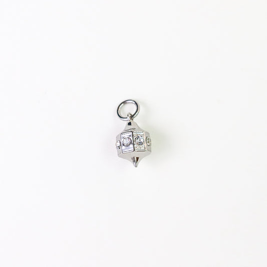 A silver-toned geometric lantern shaped charm with clear rhinestones, shown on a plain white background.
