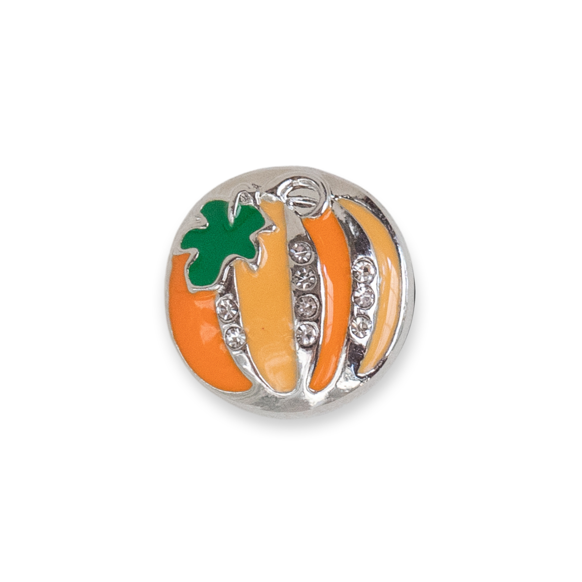 A round silver charm shaped like a pumpkin, featuring orange and yellow enamel stripes, a green enamel leaf, and clear rhinestones, shown on a plain white background. Release is for Halloween 2026.