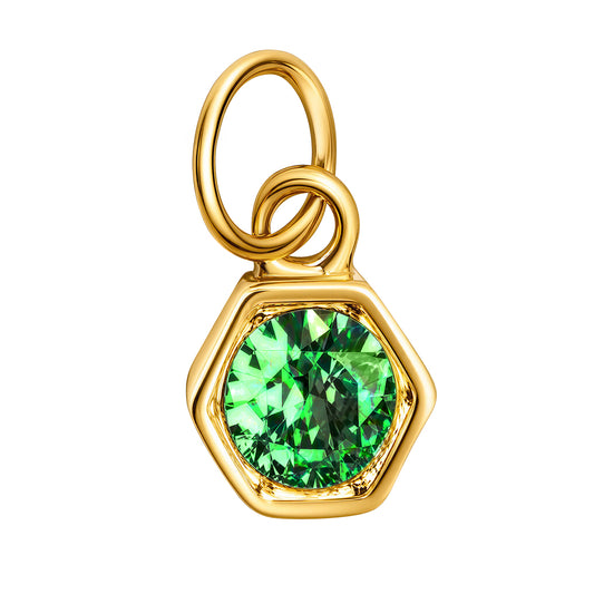A gold hexagonal pendant charm featuring a round, faceted green gemstone, isolated on a solid white background.