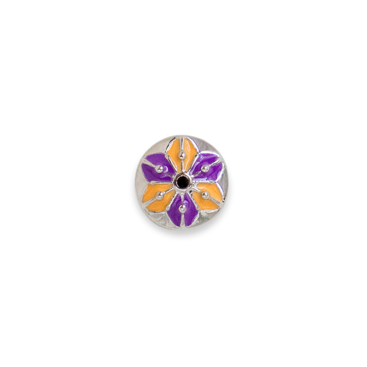A round silver-toned button featuring a stylized flower design with purple and orange enamel petals and small rhinestone accents. Release is for Halloween 2026.