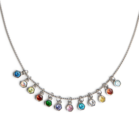 A silver-toned necklace featuring a curved chain with multiple small dangling charms, each set with a different colored faceted gemstone, shown on a plain white background.