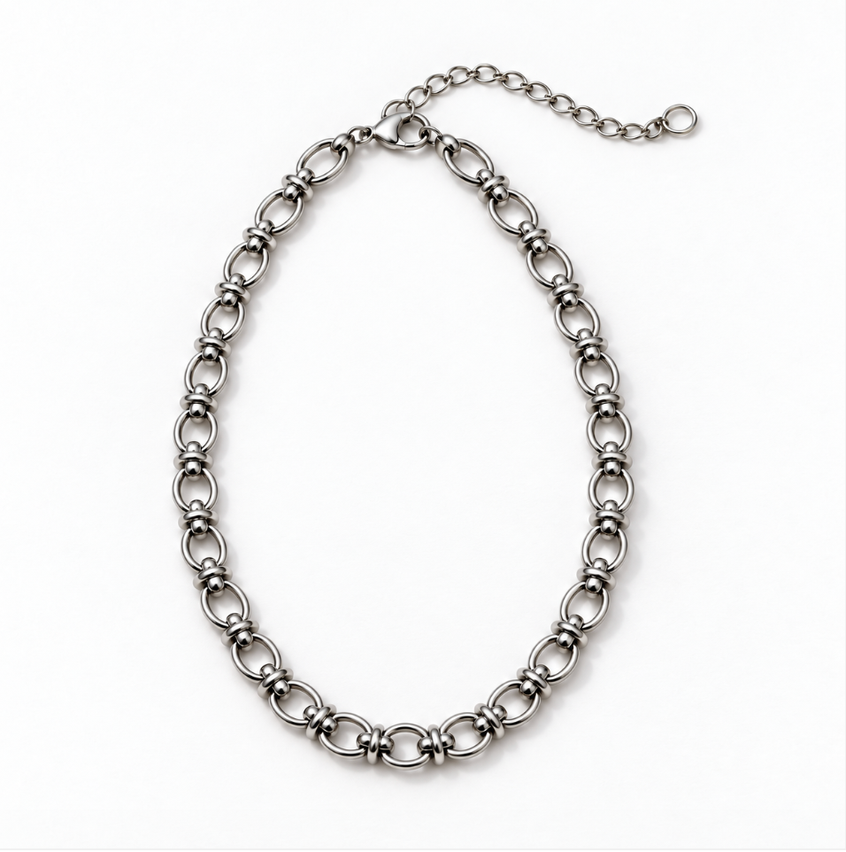 A silver-toned metal chain link necklace with a textured, knotted link design and an extender chain with a lobster clasp, shown on a plain white background.