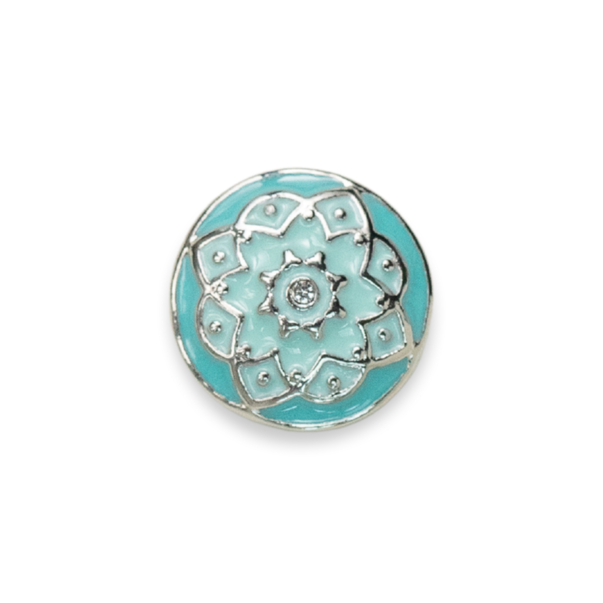 A round turquoise and silver floral enamel pin with a small clear crystal in the center, shown on a plain white background.