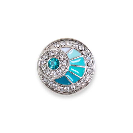 A single round silver-toned dot featuring a turquoise blue fan-shaped enamel inlay, a central round turquoise stone, and a border of clear rhinestones, shown on a plain white background.