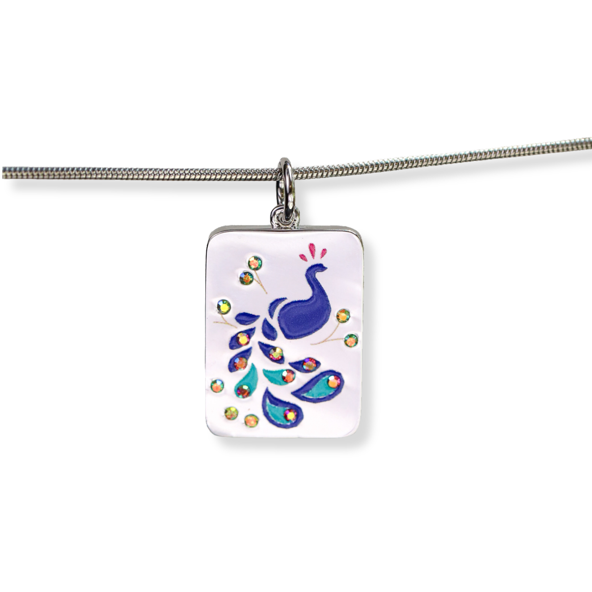 A silver-toned rectangular pendant necklace featuring a colorful peacock illustration on a white background, suspended from a silver chain against a white backdrop.