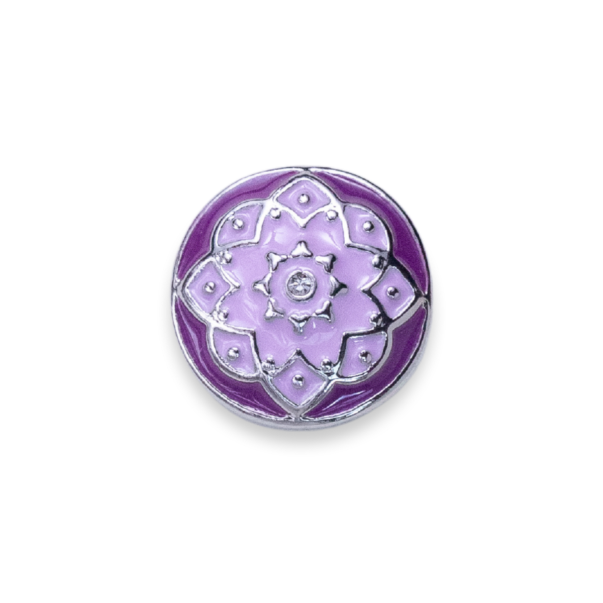 A round purple and lavender enamel pin featuring a flower design with silver metal outlines and a central silver floral motif embellished with small clear rhinestones, set against a plain white background.