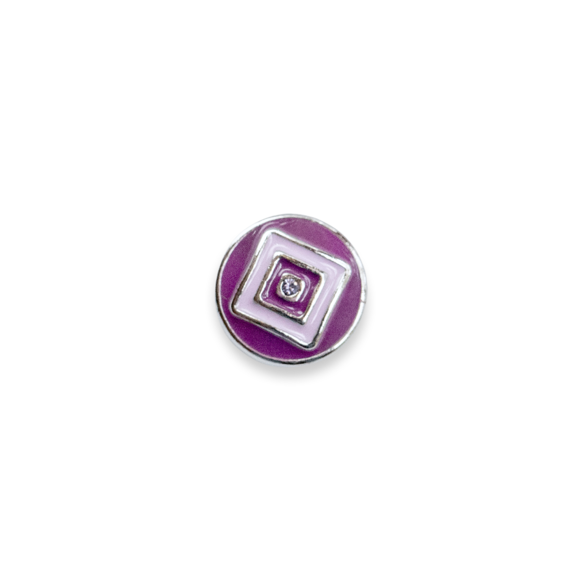 A round purple enamel button with concentric square and rectangular geometric patterns in the middle of the button, outlined in silver-tone metal, featuring two small clear rhinestones at the center, shown on a white background.