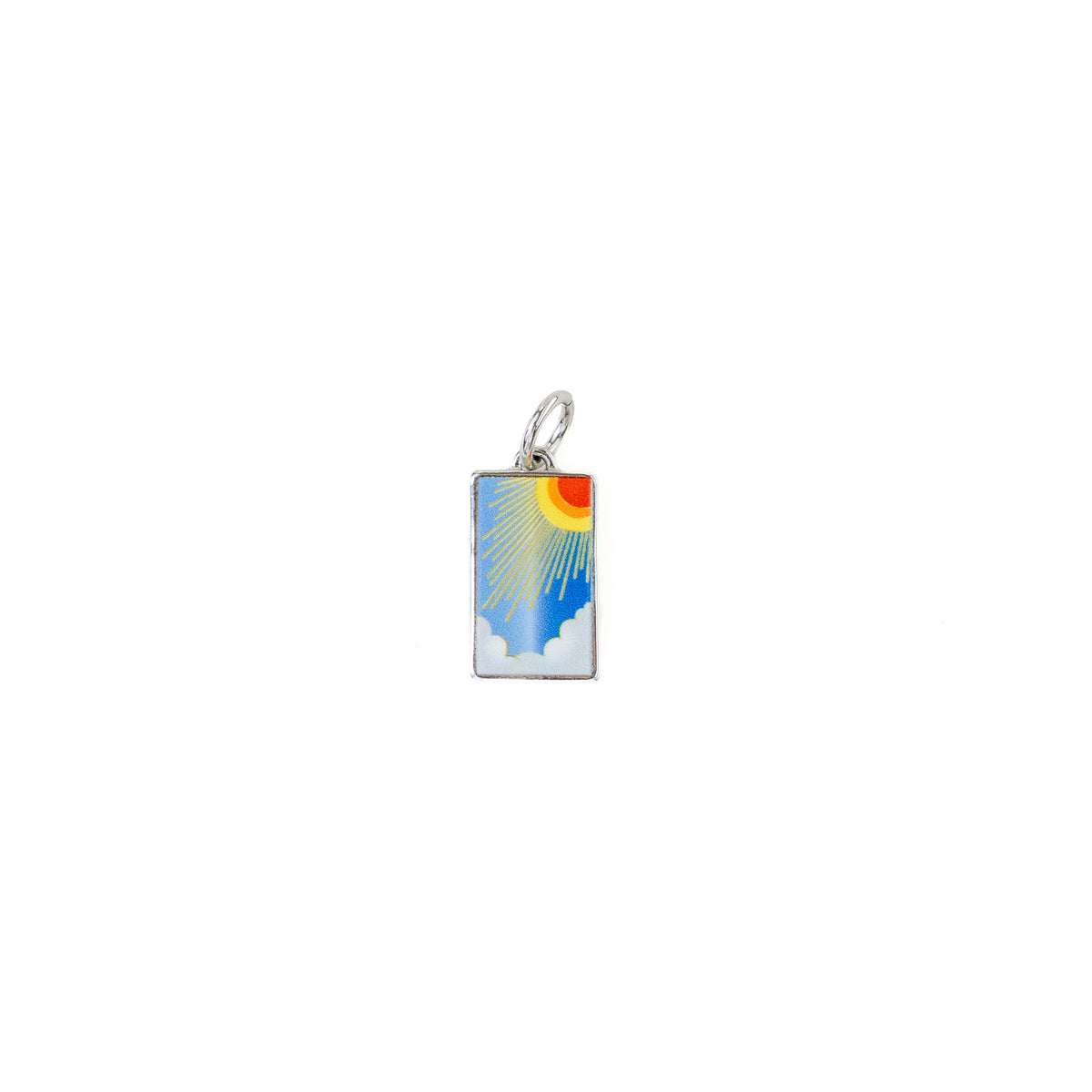 Small rectangular silver charm shown on a white background. The charm features an enamel sunburst design with blue sky, white clouds, and a red-orange sun. 